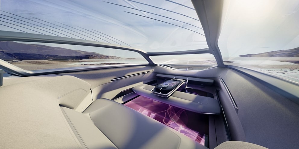 The interior of the Lincoln Model L100 concept vehicle is shown here with a pink design on the digital floor.