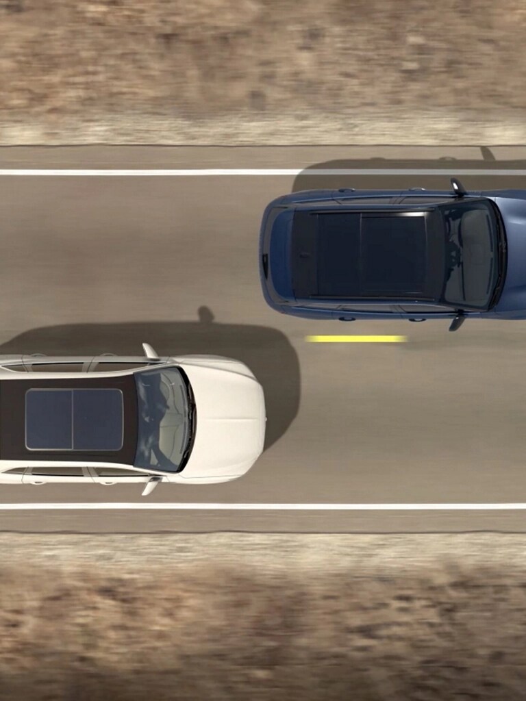 Illustration d’un Lincoln Aviator 2026 passant devant un autre véhicule, vue du haut